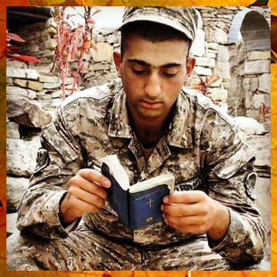 Young Armenian soldier reads his bible.